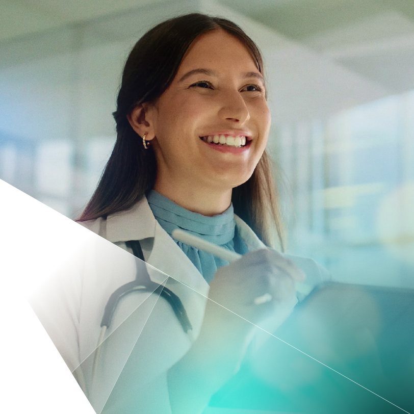 A Premise team member smiling in a bright, modern workplace